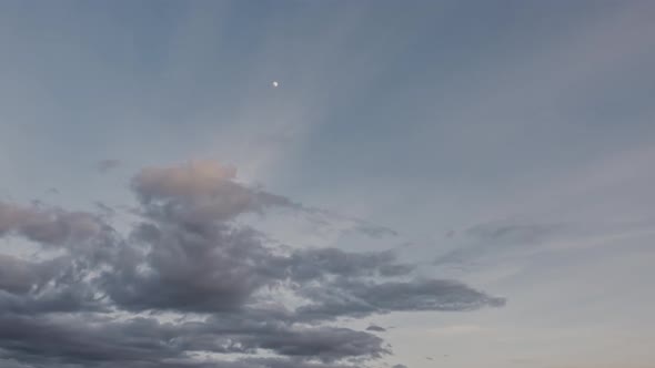 Beautiful view of floating clouds in sky during sunset. Time lapse.