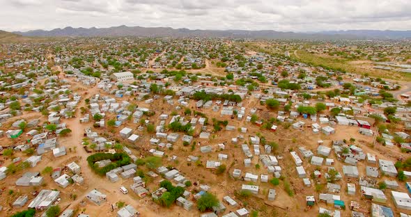 Rural Landscape Covered with Shacks and Containers.  Drone Shot of Poor and Overcrowded Urban