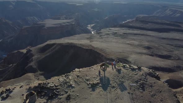 Aerial footage of the Fish River Canyon in Namibia, rocky hills and cliffs