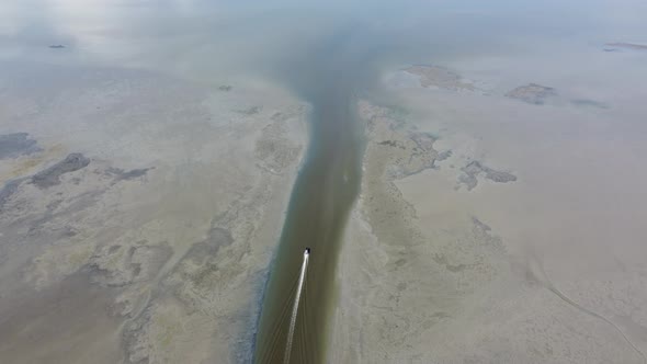 Aerial top down view fishermen boat move at canal