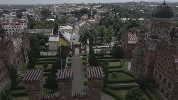 Drone is Circling Around the Flag of Ukraine on Top of Chernivtsi University