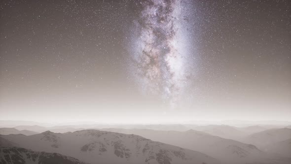 Milky Way Above Snow Covered Terrain alt