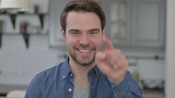 Portrait of Beard Young Man Pointing Finger 