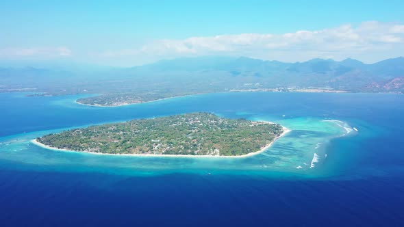 Aerial drone view panorama of idyllic tourist beach time by blue green water and white sandy backgro