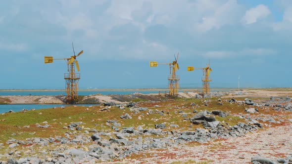 Wind Mills At The Sea Coast In Bonaire, Kralendijk Used To Control Water Pump For Salt Flats - wide