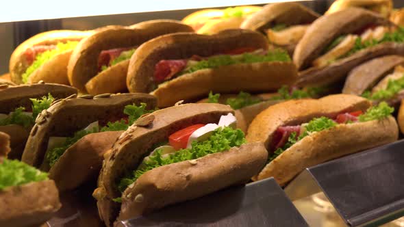 Closeup on Sub Sandwiches on Display on a Counter in a Store