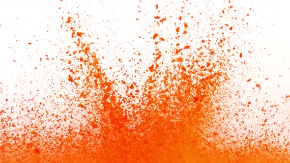 Super Slow Motion Shot of Orange Powder Explosion Isolated on White Background at 1000Fps