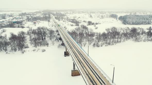 Beautiful Winter Landscape with Frozen River and Road Bridge