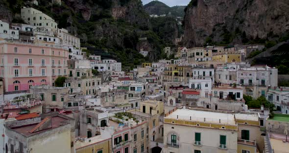 Historically Rich Town On Italy's Scenic Amalfi Coast With Towering Rocky Cliffs In Background. Aeri