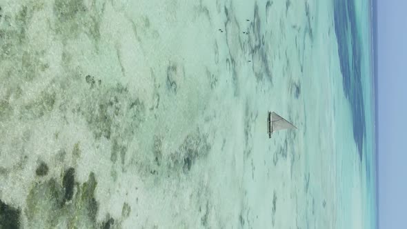 Tanzania Vertical Video  Boat Boats in the Ocean Near the Coast of Zanzibar Aerial View