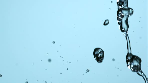 Water pouring and splashing in ultra slow motion 1500fps on a reflective surface - WATER POURS 182 alt