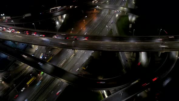 Aerial View of Highway Interchange at Night Timelapse