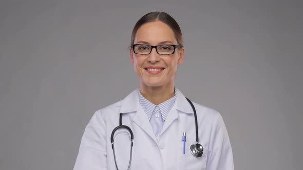 Smiling Female Doctor Showing Thumbs Up