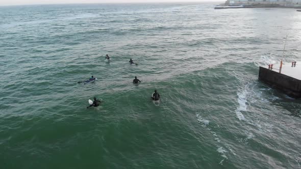 Surfers Waiting For Waves