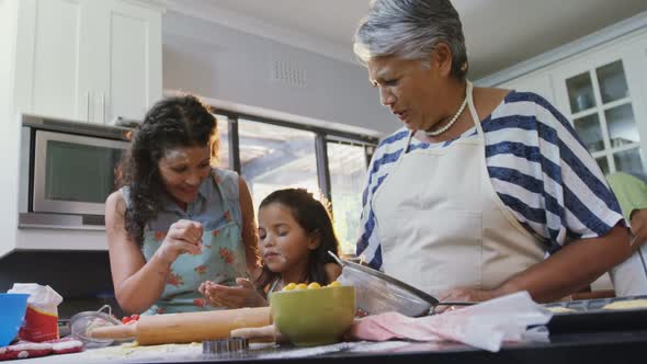 Family having fun while preparing food in kitchen 4k