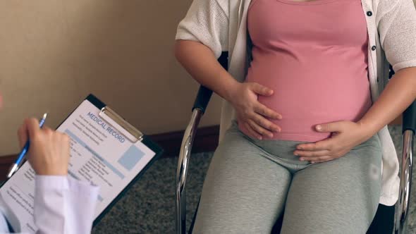 Pregnant Woman and Gynecologist Doctor at Hospital