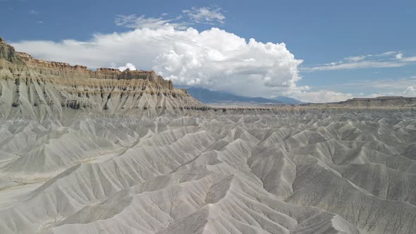 Aerial view in the Utah desert in Caineville with clouds over the Mountains