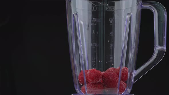 Strawberries and Currants are Poured Into the Blender Bowl