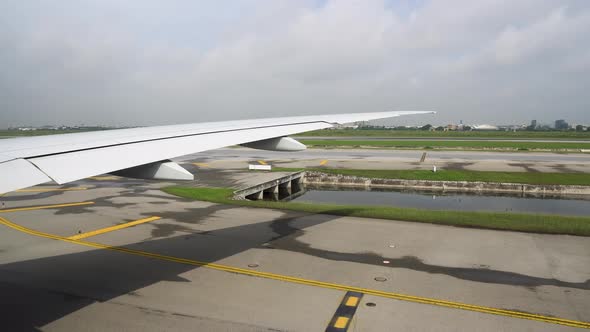 View From the Plane Window at the Runway, the Airplane Landed at the Airport