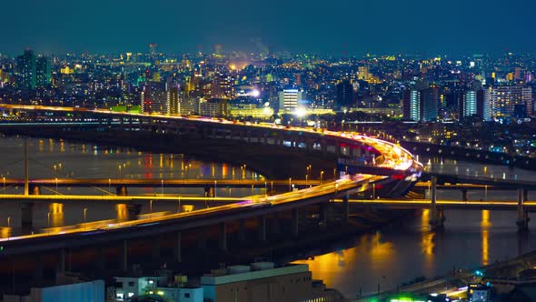 time lapse of highway road bridge with Arakawa river in Tokyo at night, Japan