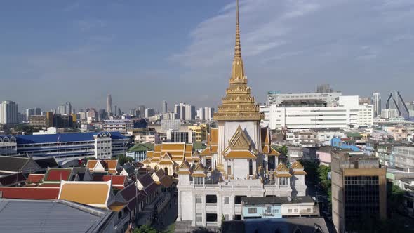 Fly up shot of the back of Wat Traimit temple, golden buddha, Bangkok, Thailand