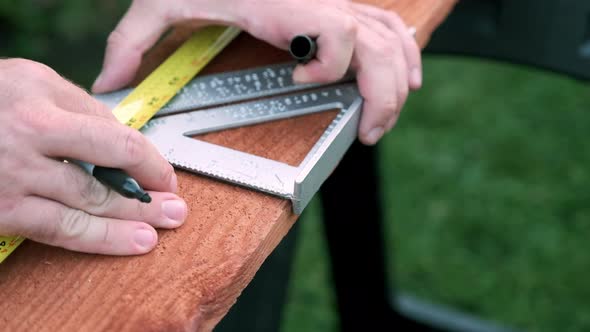 Carpenter Prepares Wood for Woodworking Project, Slow Motion Hands Taking Measurements on Wood Plank