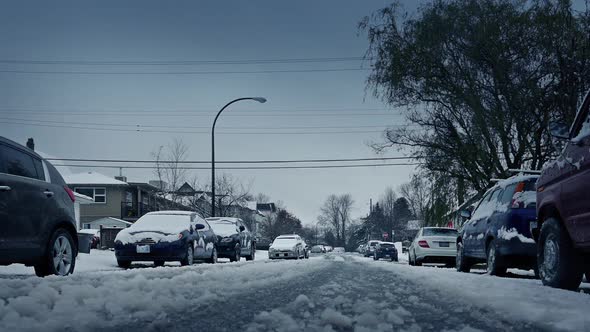 Snowy Road With Cars Passing In Winter