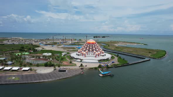 Waterfront mosque with 99 orange domes in Makassar city Sulawesi Indonesia along the ocean on a sunn
