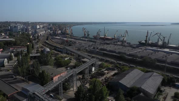 Loading Grain Onto a Cargo Ship for Transportation By Sea By a Conveyor Belt Machine