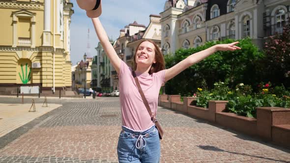 Beautiful Young Woman Tourist Walking in the City Center