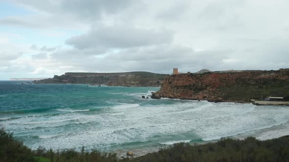 AERIAL: Huge Sea Waves Rolling to Shore of Ghajn Tuffieha Bay