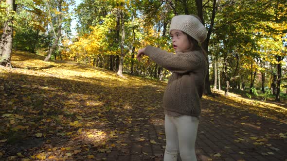 Adorable Girl with Down Syndrome Dancing in Nature
