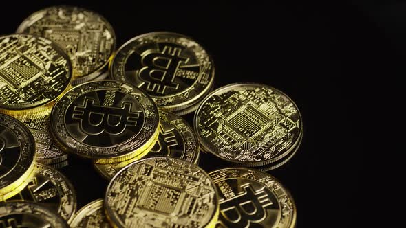 Rotating shot of Bitcoins (digital cryptocurrency) - BITCOIN 0588