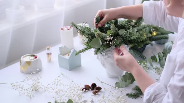 Woman Decorated a Christmas Table Decoration