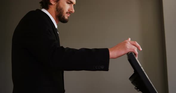 Businessman closing a briefcase