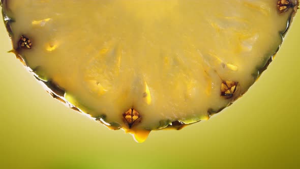 Flowing Pineapple Juice From Pineapple Slice Macro Shot in Slow Motion