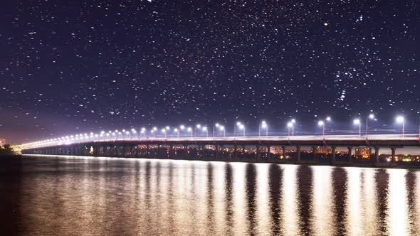 Bridge over the Dnieper River in Dnipro City in late spring in early spring, thick clouds. Ukraine