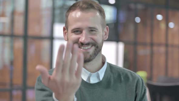 Portrait Shoot of Young Man Inviting By Hand Sign