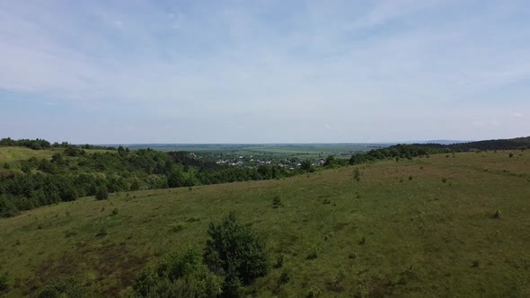 Aerial drone view of a flying over the rural agricultural landscape.