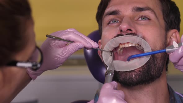 Portrait of Male Patient During Dental Cleaning