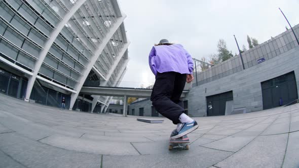 Active Man Jumping on Longboard Outdoor