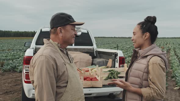 Farmer And Woman Talking About Something