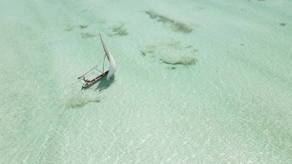 A Boat Floats on the Water of the Ocean Near the Coast of Zanzibar Tanzania