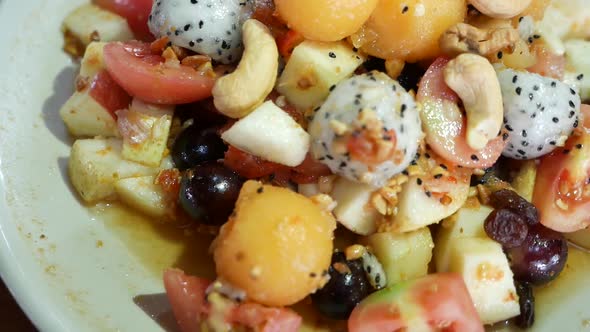 Close Up Footage of Thai Style Mix Exotic Fruits Somtum (Salad) with Sweet and Salty Dressing Includ