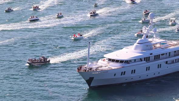 Yacht MV Katharine, accompanied by countless well-wishers, leaves port