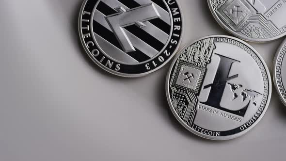 Rotating shot of Litecoin Bitcoins (digital cryptocurrency) - BITCOIN LITECOIN 0131