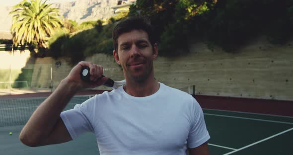 Man playing tennis on a sunny day