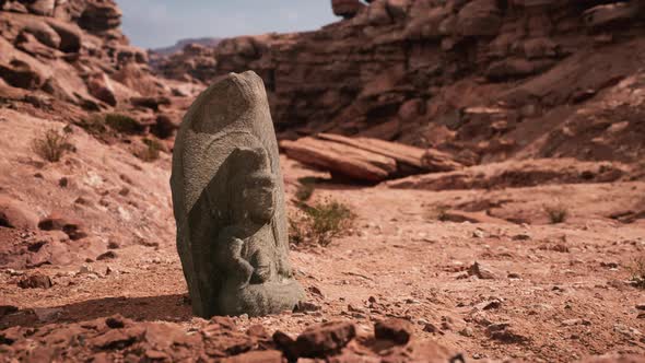 Ancient Statue on the Rocks Desert