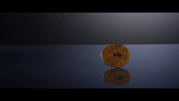 Falling cookies from above onto a reflective surface - COOKIES 196