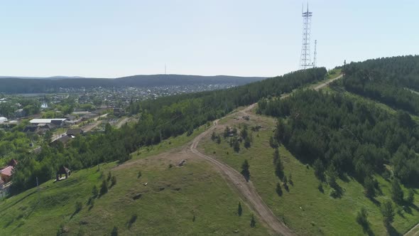 Aerial view of a mountain covered with a forest in provincial city 09